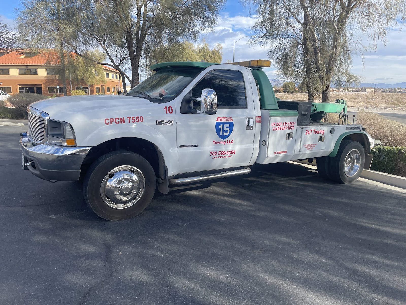 White Ford F-450 Super Duty tow truck for the affiliated towing operation, Las Vegas NV